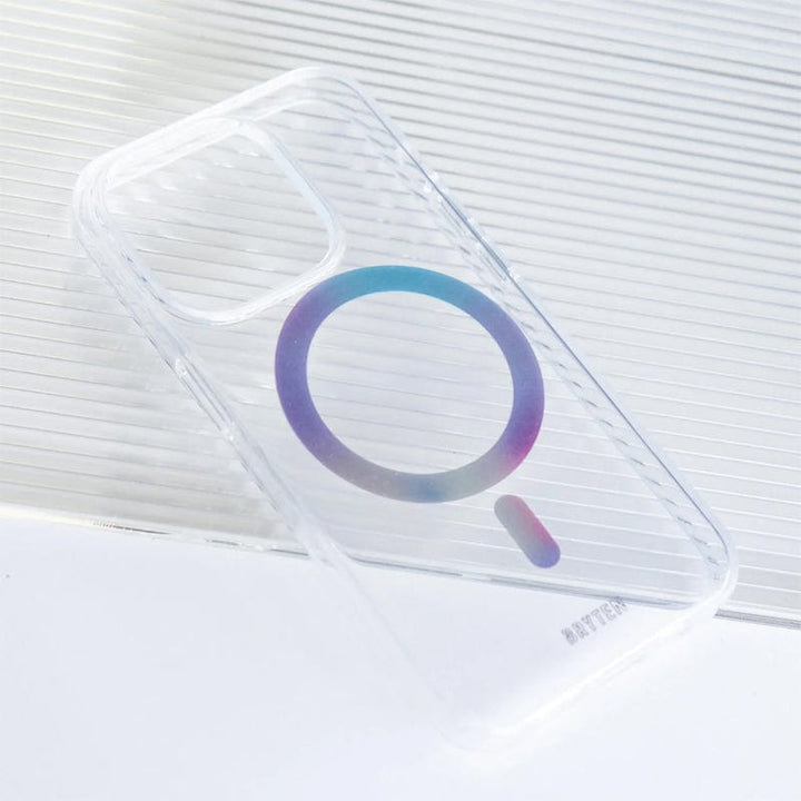 The Bryten by Raptic iPhone 15 MagFx MagSafe Case, a clear phone case featuring a circular and linear design in the middle and placed on a striped white surface, ensures drop protection while being compatible with MagSafe chargers and wireless charging.