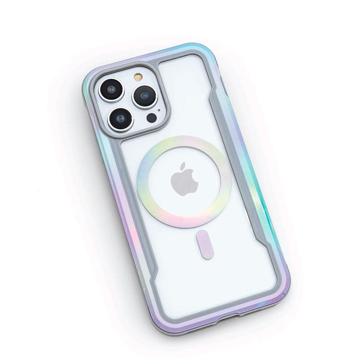 A smartphone in a white iridescent Raptic Shield 2.0 iPhone 15 MagSafe Case featuring three rear cameras, the Apple logo, and compatibility with MagSafe accessories from the brand Raptic.