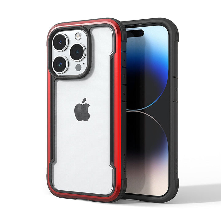 Two smartphones encased in Raptic Shield iPhone 15 Shield cases. One case is predominantly red and white, and the other is black. Boasting 3-metre drop protection and meeting MIL-STD-810G Standards, both devices display the Apple logo on the back.