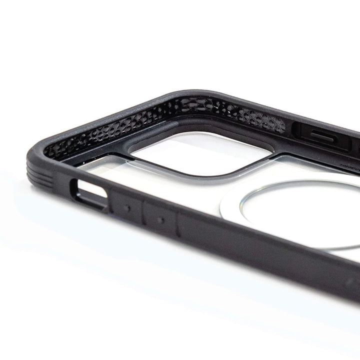 Close-up of the Raptic Shield 2.0 iPhone 15 MagSafe Case by Raptic, featuring textured edges and a transparent back panel, offering 3-metre drop protection. Photographed on a white surface.