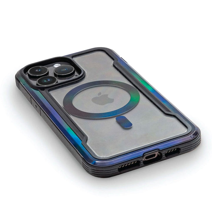 Close-up of a smartphone with a Raptic Shield 2.0 iPhone 15 MagSafe Case, revealing the device's Apple logo and MagSafe ring. The phone, offering 3-meter drop protection, has three rear camera lenses and is placed on a white surface.