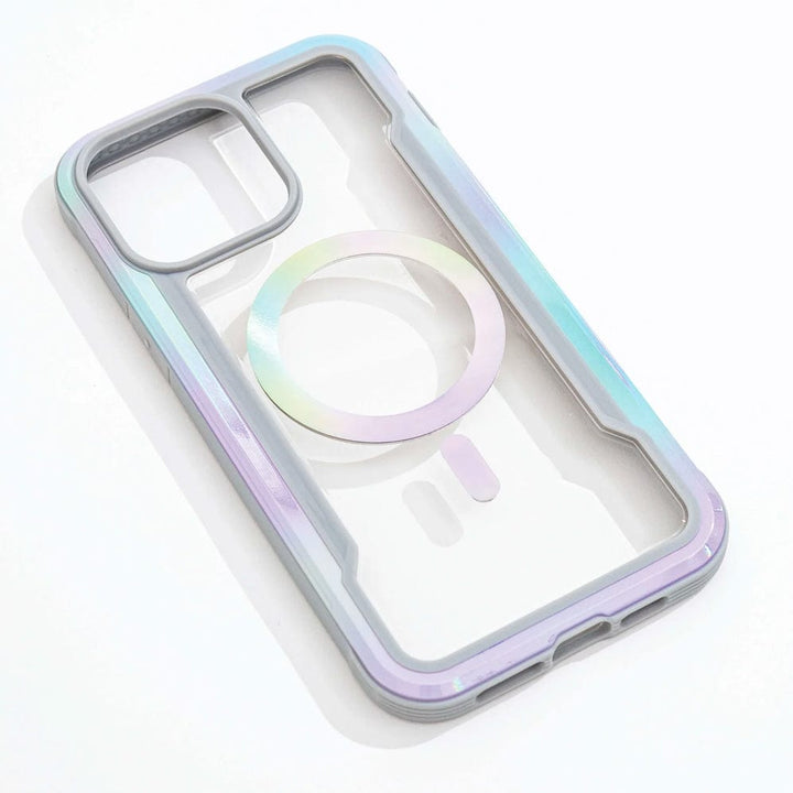 The Raptic Shield 2.0 iPhone 15 MagSafe Case, a transparent cover with iridescent trim, two camera cutouts, and a circular magnetic attachment ring, lies on a white surface, offering 3-metre drop protection.