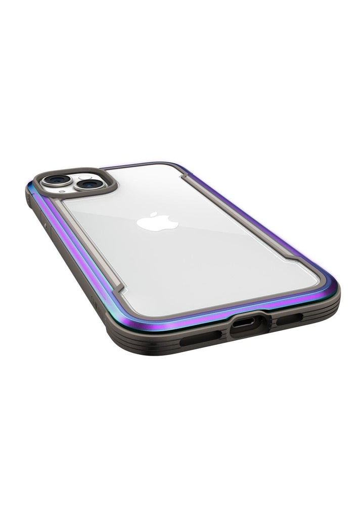 A clear phone case with a purple-tinted border, showing a white phone inside and featuring dual camera lenses. The Raptic Shield iPhone 15 Shield Case is engineered with 3-metre drop protection and meets MIL-STD-810G Standards.