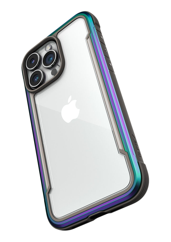A smartphone with a triple camera setup is encased in the Raptic Shield iPhone 15 Case, offering clear protection with metallic accents and 3-metre drop protection.