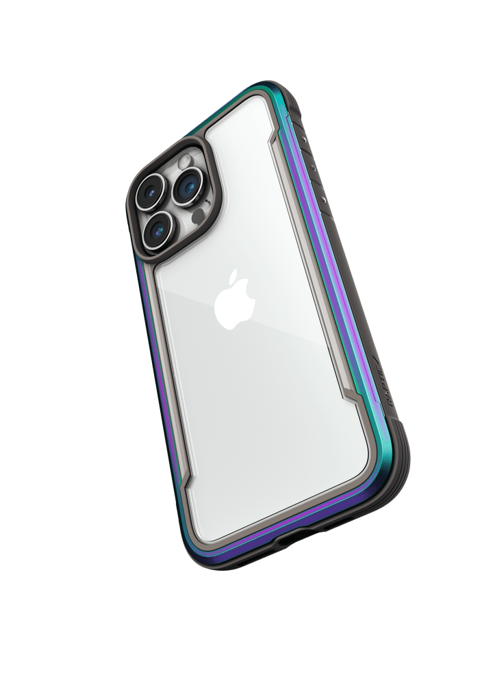 The Raptic Shield iPhone 15 Case features a transparent design with black edges, flaunting a metallic blue and purple gradient. It showcases three rear cameras and the Apple logo, all while offering 3-metre drop protection and meeting MIL-STD-810G Standards.