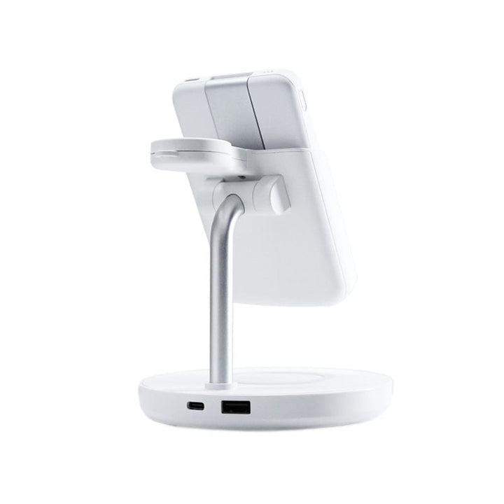 The Urban 6-in-1 MagSafe M6 Wireless Charger Station by Urban is a white wireless charging stand featuring a circular base with two ports for charging and connectivity. It has an adjustable silver arm that extends to support smartphones vertically, compatible with iPhone-compatible magnetic cases, adding convenience on a plain white background.