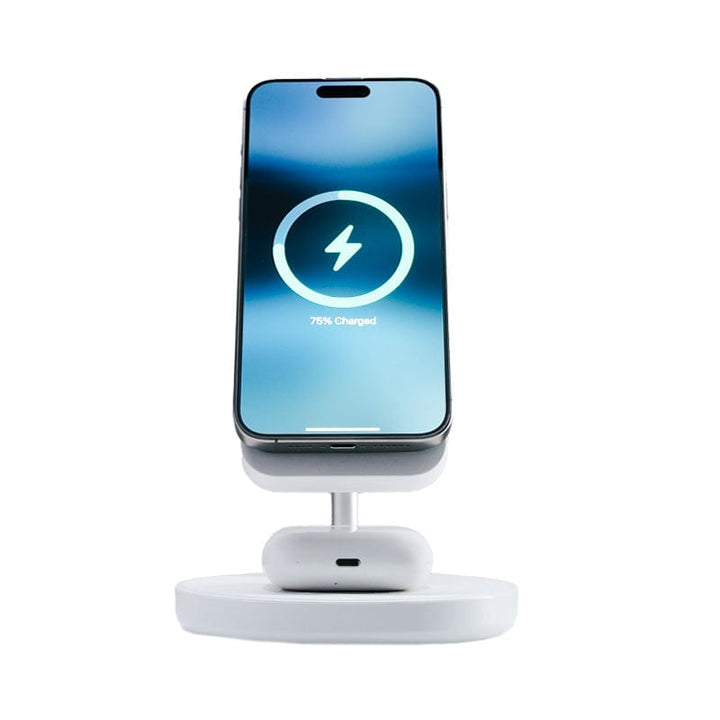 An elegant Urban 6-in-1 MagSafe M6 Wireless Charger Station, designed to be iPhone-compatible with magnetic cases, cradles a smartphone upright displaying "78% Charged." Beneath the phone, a set of white wireless earbuds lie horizontally. Both the charger station and devices boast a modern, minimalistic design.