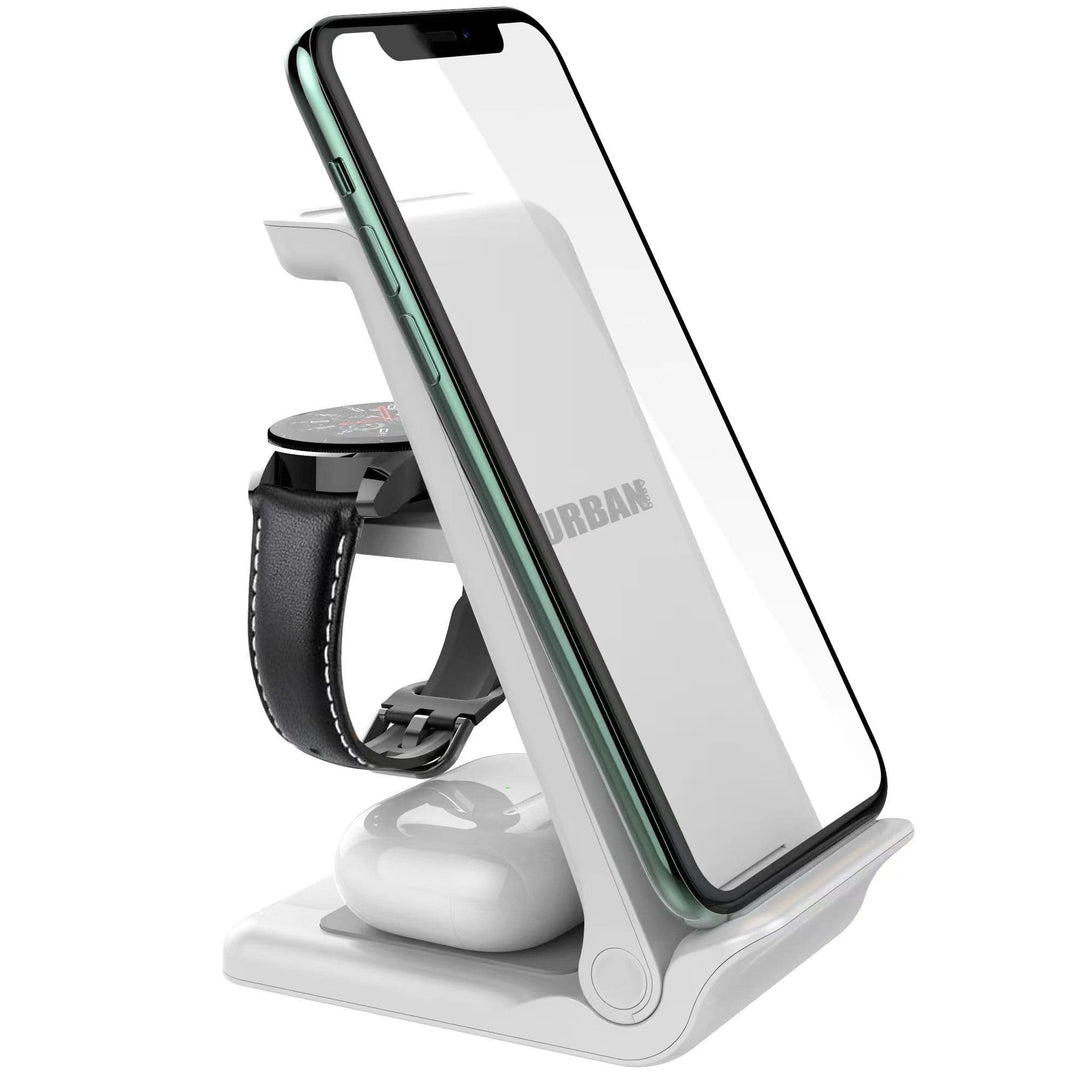 The Urban Travel S 3 in 1 Wireless Charger by Urban, a white charging stand, is perfect for holding a smartphone, a smartwatch, and wireless earbuds.