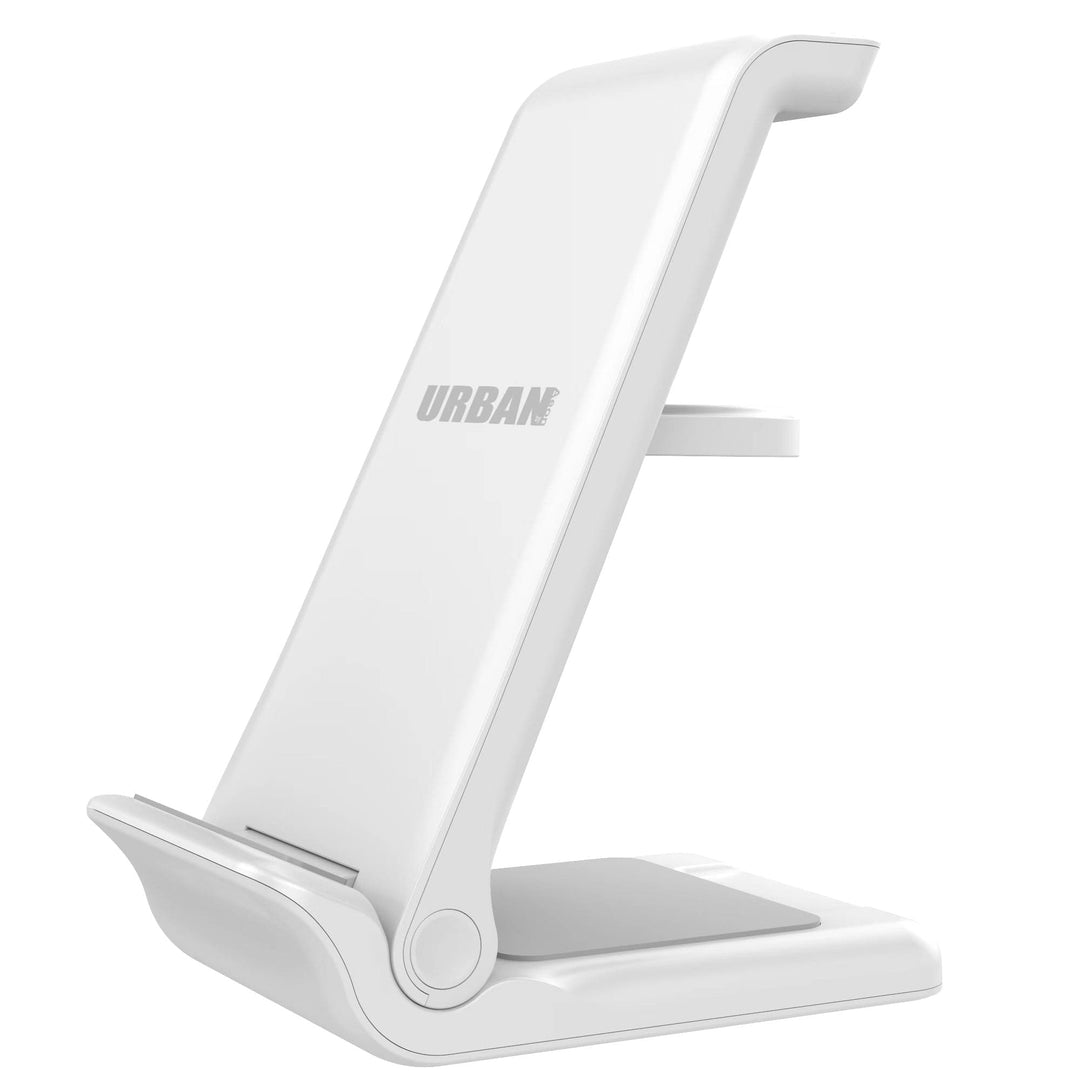 Introducing the Urban Travel S 3 in 1 Wireless Charger: a white, foldable stand that doubles as a smartphone and tablet holder. Featuring the Urban brand name printed near the top, this ergonomic design includes a stable base, an angled support, and a small shelf, making it the perfect accessory for your wireless charging smartphone.