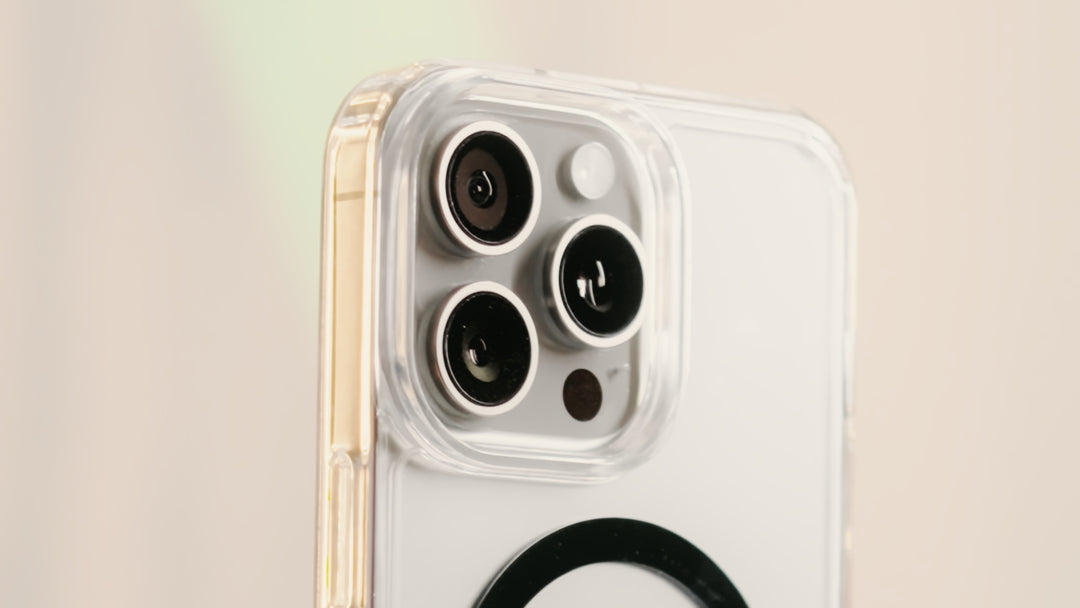 Close-up of the back of a smartphone with a triple camera setup and a transparent protective case.