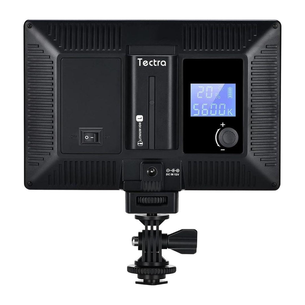 A black MobileTechnica Tectra 6000mAh Battery for Sony NP-F970/F750/F550 (2-pack) is shown in a rear view, featuring a power switch, digital display with brightness (20%) and color temp (5600K), control knob, USB-C port, battery slot, and bracket.