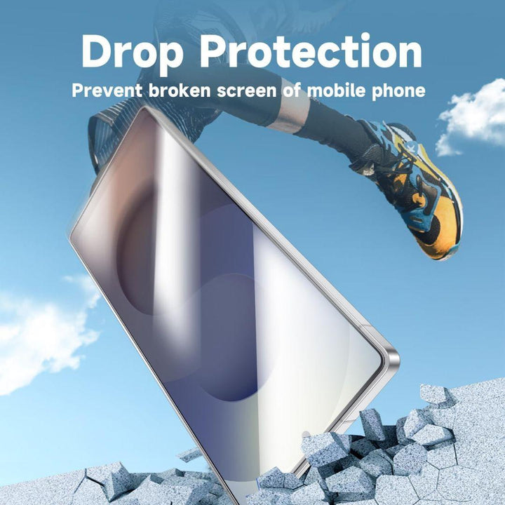 A smartphone drops on shattered concrete as a person in orange sneakers jumps above. Text: “Protect your Samsung Galaxy S25 Ultra with MobileTechnica’s Magic John Tempered Glass Screen Protector 2-pack.” Blue sky background.