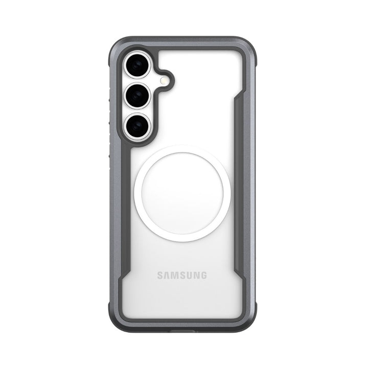 The Samsung S25 Shield Case by Raptic features a clear back, dark grey bumper, and military-grade shock absorption. It includes three camera cutouts on the top left, a circular MagSafe compatibility ring at the center, and "Samsung" is printed at the bottom.