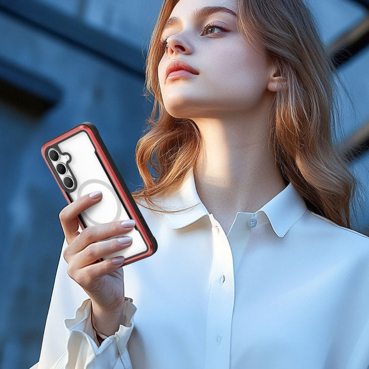 A woman in a white blouse, with long wavy light brown hair catching the light, is looking up while holding a smartphone with a Raptic Samsung S25 Shield Case. The blurred background features architectural elements as she contemplates the moment.