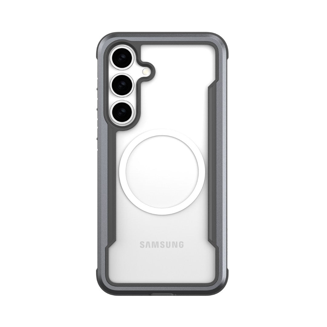 The image features a Samsung Galaxy S25 encased in a Raptic Shield case, providing military-grade protection. The phone displays three vertically aligned rear cameras and a sleek gray border with a circular white pattern, "SAMSUNG" printed near the bottom, seen from the back.