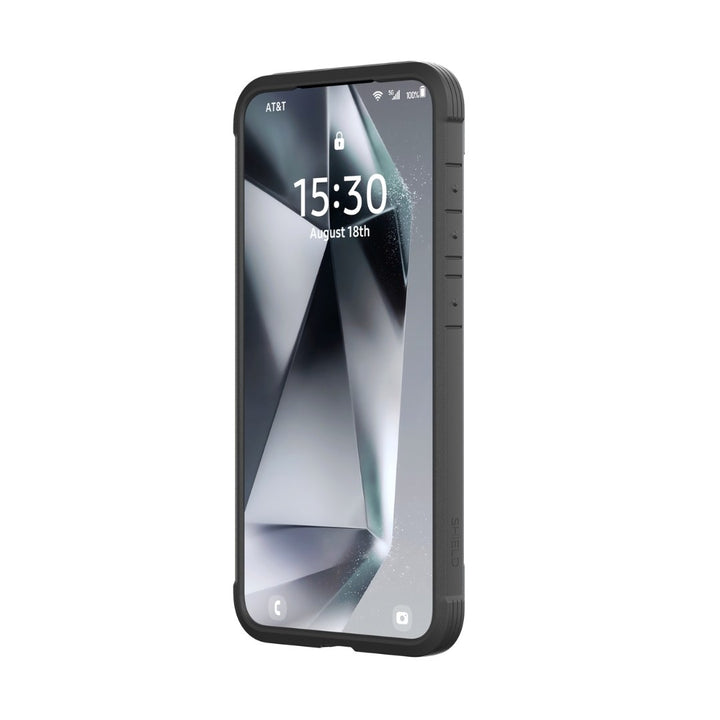 A smartphone with a rugged black Raptic Samsung S25 Shield Case features military-grade protection and a textured side grip. The screen shows "15:30" on August 18th, connected to AT&T with full battery. The wallpaper displays abstract geometric shapes in shades of gray.