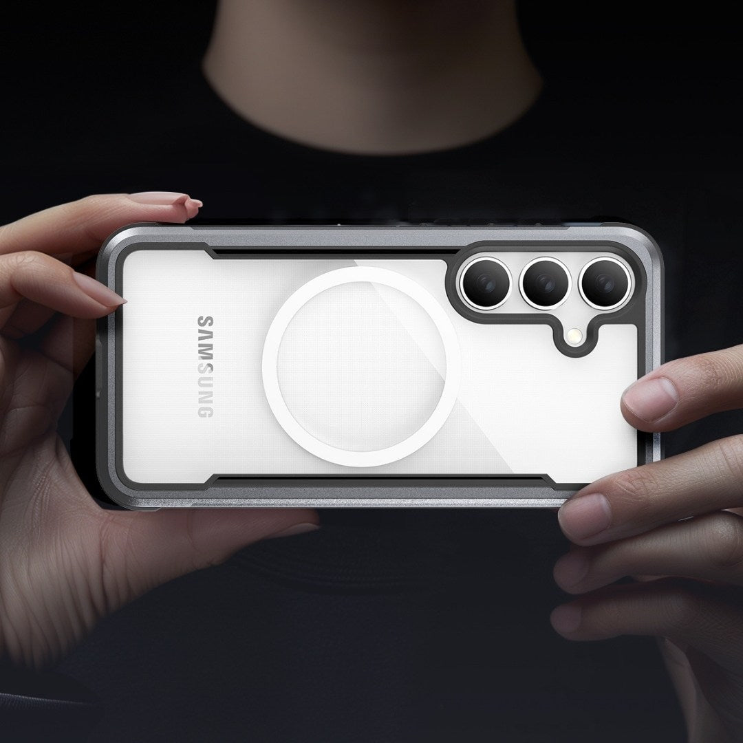 A person holds a Raptic Samsung S25 Shield Case horizontally, displaying its sleek white finish. With three camera lenses in the top right corner and a circular element near the center, the phone's edges boast military-grade protection for superior shock absorption, while their hands remain visible.