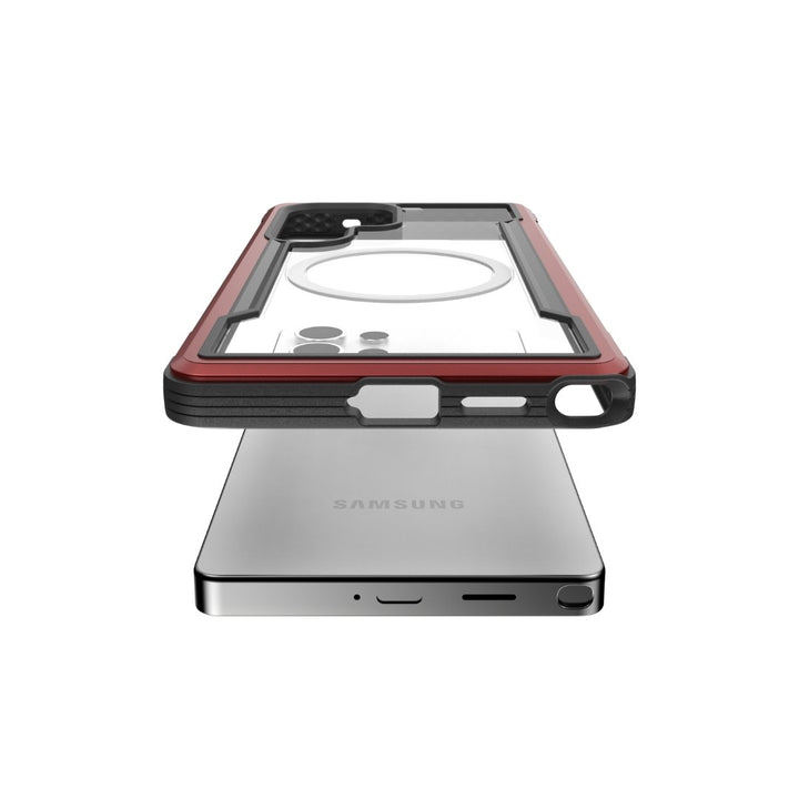 A Samsung Galaxy S25 with the "Samsung" logo at the bottom is shown, with a Raptic Shield Case floating above. The case, designed for military-grade protection, features a red frame and transparent back with a circular white ring for optimal shock absorption.