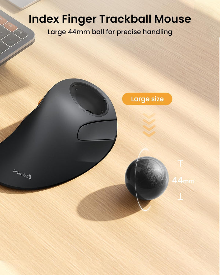 A gray MobileTechnica ProtoArc EM03 Wireless Bluetooth Trackball Mouse sits on a wood desk next to a loose 44mm ball. Text above reads "Index Finger Trackball Mouse—Large 44mm ball for precise handling." Features ergonomic, wireless control.