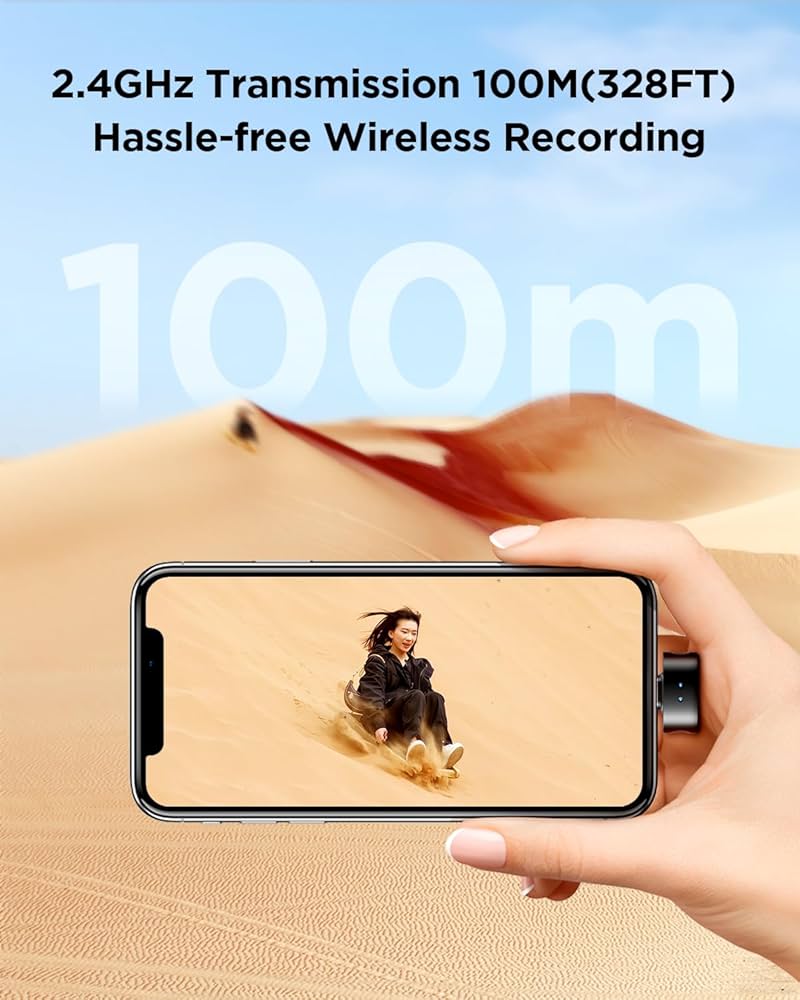 A lightweight BOYA Wireless Lavalier Microphone-05 is connected to a phone displaying a woman sliding down a sand dune, mirroring the scene. Text above reads, "2.4GHz Transmission 100M(328FT) Hassle-free Wireless Recording.