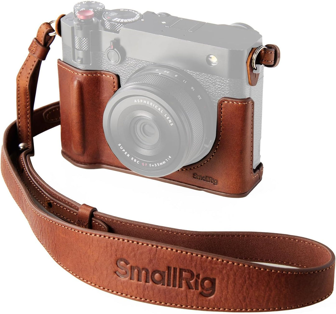 The SmallRig GFX100RF Leather Case Kit—featuring a brown leather case, black thumb pad, shoulder strap, and concave shutter button cap—adds comfort and protection to your FUJIFILM GFX100RF. "Smallrig" is embossed on the padded shoulder strap.