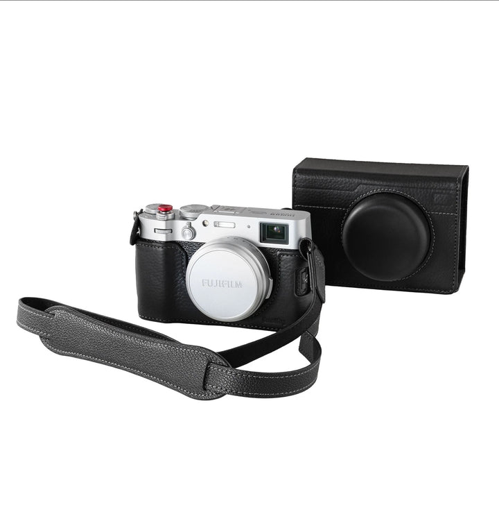 The SMALLRIG Leather Case Kit for FUJIFILM X100VI by MobileTechnica, featuring a black leather half case, flip cover, and shoulder strap (5622), is displayed in front of a matching leather camera case with lens cover on a white background.