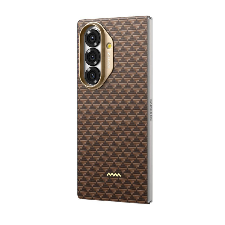 The RAPTIC Samsung Galaxy Fold 7 Skin Case in Humble Desert features a brown woven-texture pattern, metallic edges for style and protection, three vertically aligned camera cutouts in a gold module, and a small gold logo at the back’s bottom.