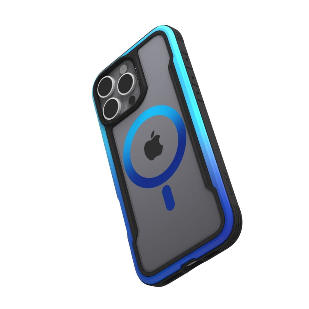 A smartphone in a rugged, blue and black Raptic Shield 2.0 MagSafe for iPhone 16 Pro Max case with a blue circular MagSafe ring on the back. The phone's camera module, featuring three lenses and a flash, is visible. The Apple logo is centered beneath the MagSafe circle. The thick TPU bumper adds substantial protection.