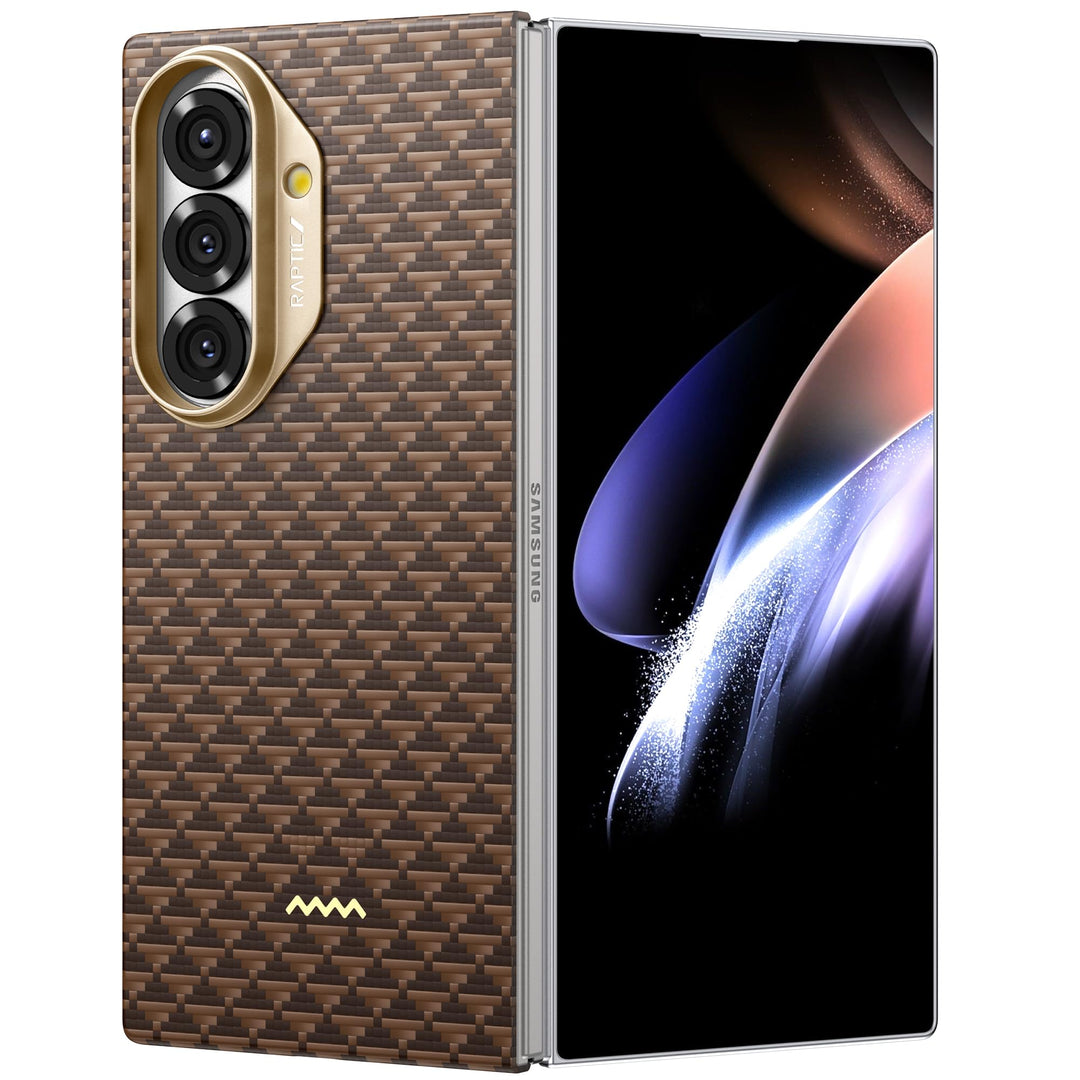 A Samsung Galaxy Fold 7 is shown partially open with its bright inner display featuring abstract art. The phone is protected by a RAPTIC Humble Desert brown textured case, which includes a gold camera module for premium style and protection.