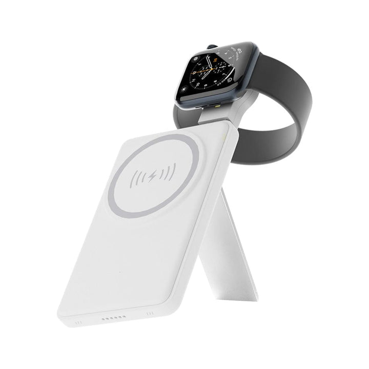 Smartwatch resting on an Urban 6-in-1 MagSafe M6 Wireless Charger Station against a white background.